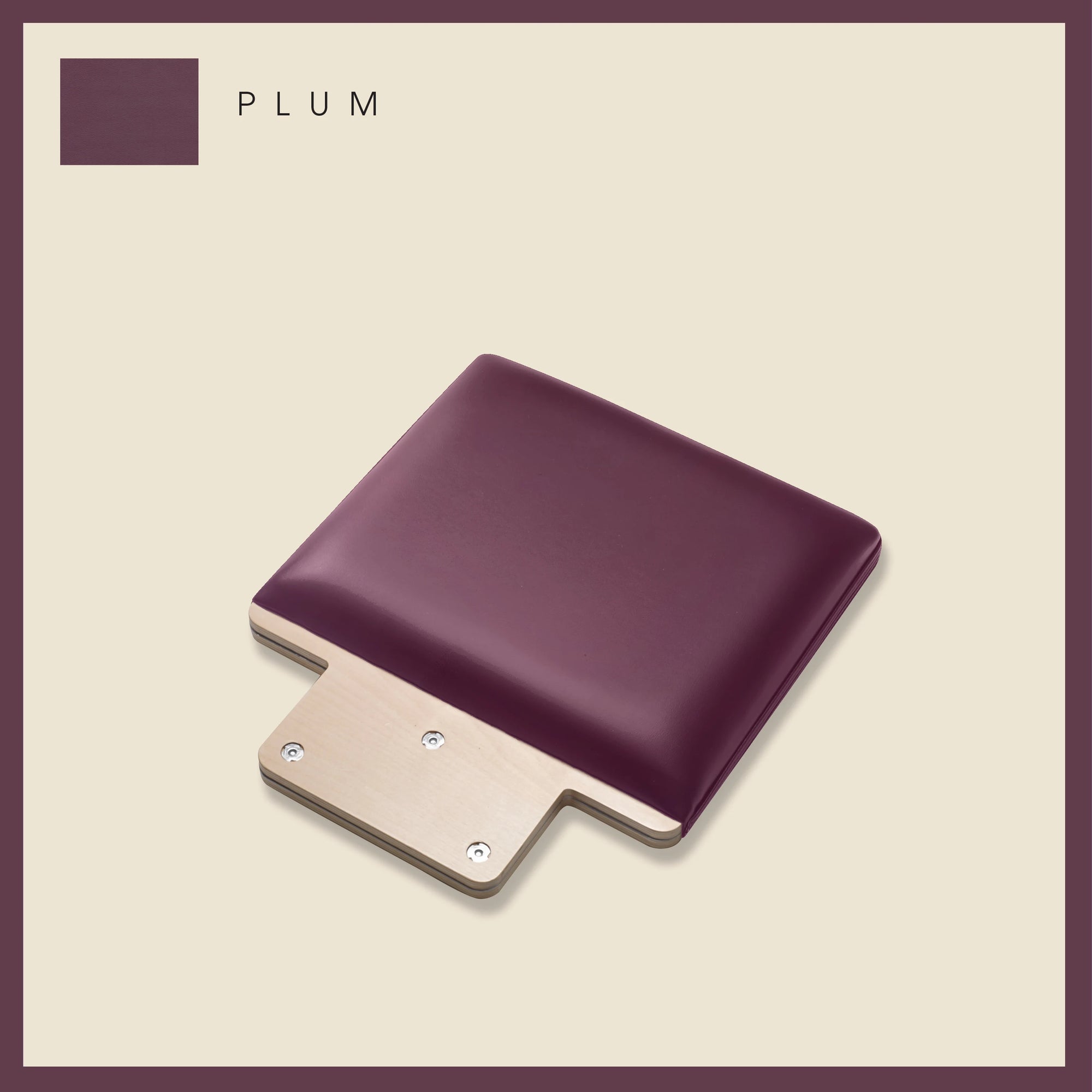 Plum-colored padded Jump Board with a sleek, minimalist design on a light beige background.