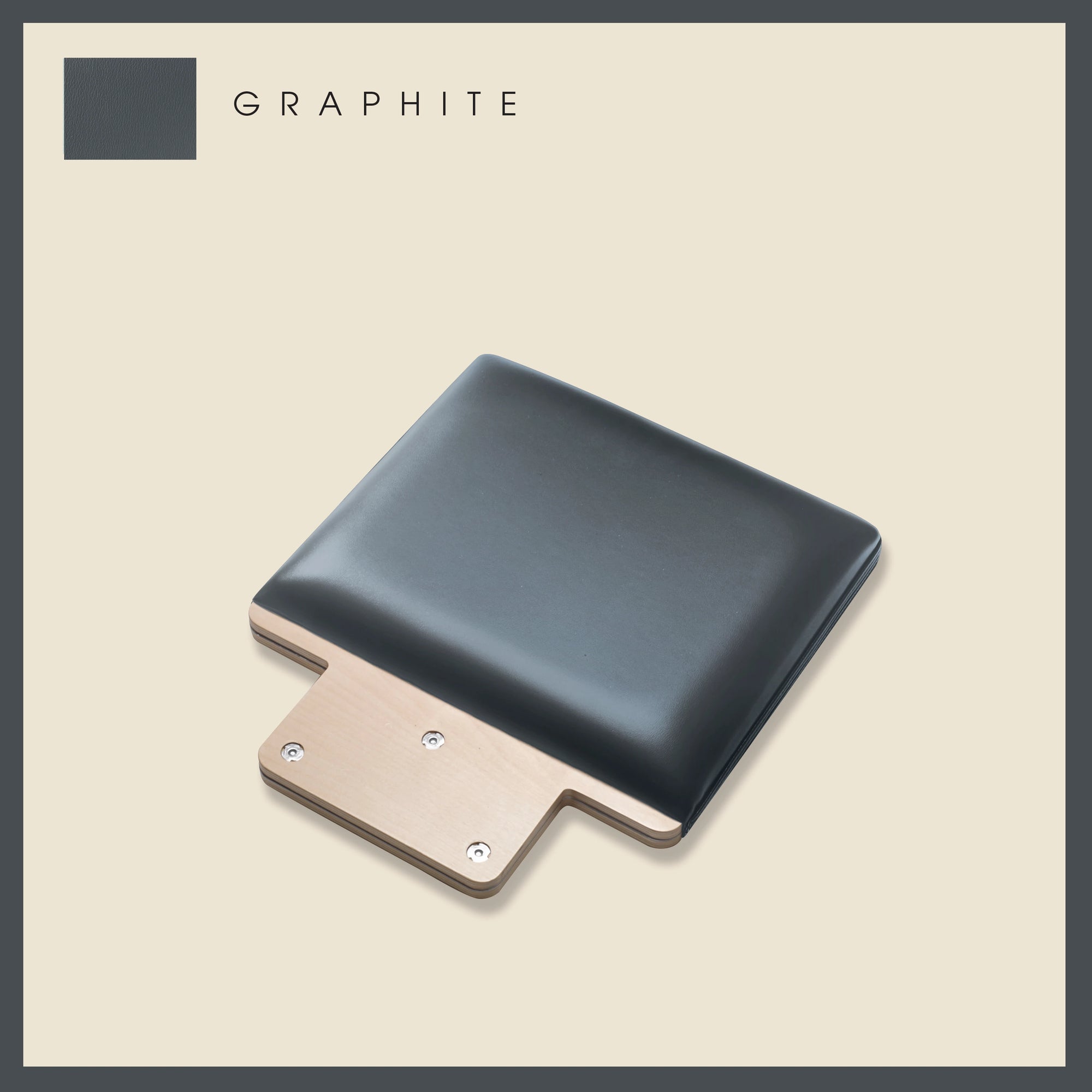 Graphite-colored padded jump board with a sleek, minimalistic design on a light beige background.